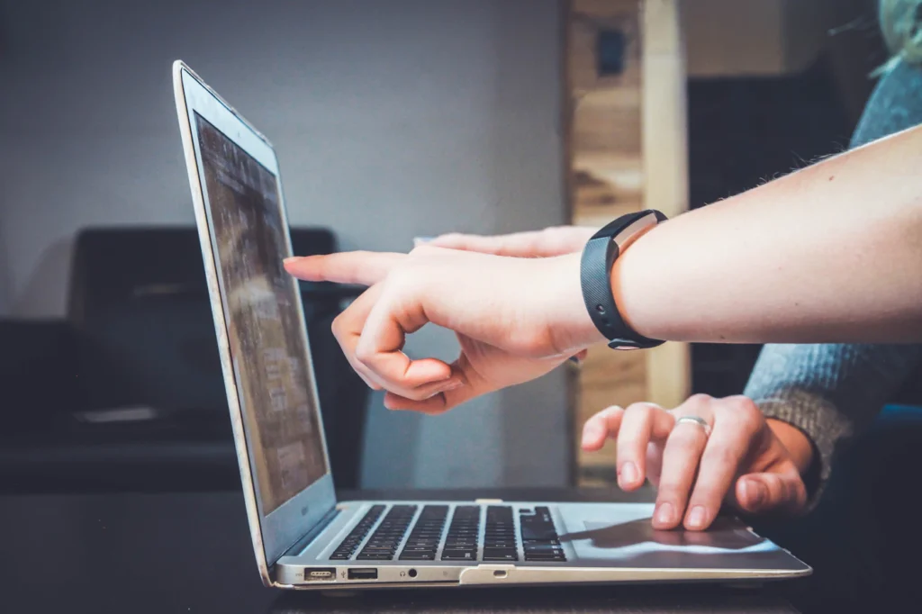 Colleagues learning together at a laptop